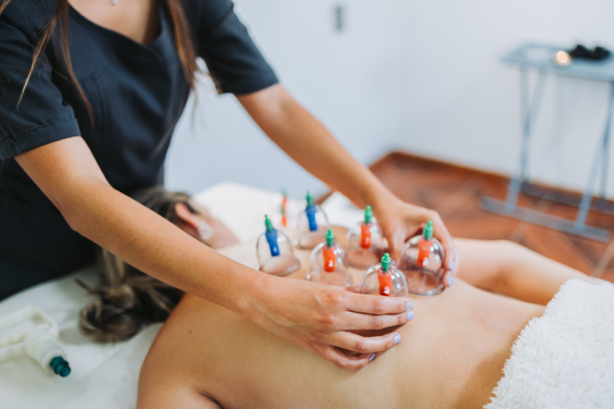 suction cups placed female patient s back by massage therapist medical spa massage center scaled